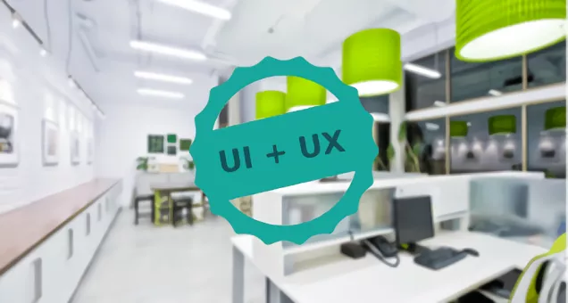 Fotografía de oficina con texto UI + UX sobrepuesto